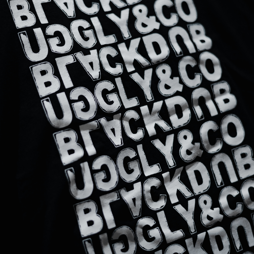 Black Repeat Tee